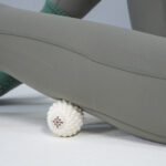 Bloom white ball under a leg