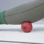 Bloom red ball under a leg